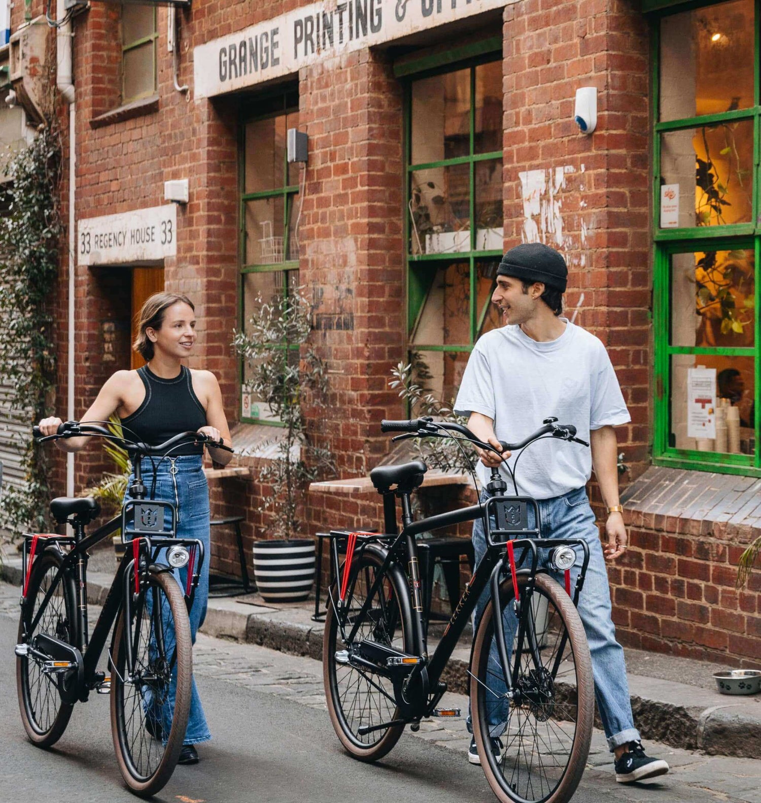 Two friends walking with Jordaan Mens Bike
